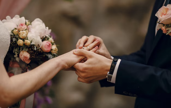 A couple exchanging rings during their wedding ceremony. Your Wedding Ceremony.