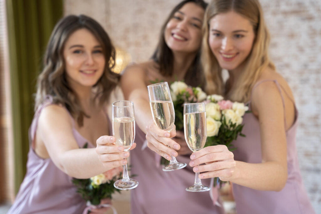 Bridesmaids drinking champagne. From Ceremony to Champagne